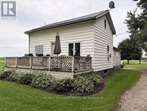 South-West Oxford (Brownsville) apartment for rent - A small house with a porch and a satellite dish on the roof.