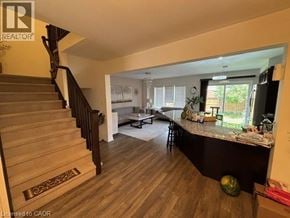 Cambridge townhouse for rent - A living room with a staircase leading to the upper floor.