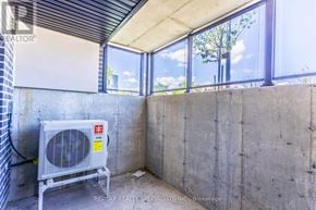 St. Catharines (E. Chester) townhouse for rent - A room with a window and a fan.