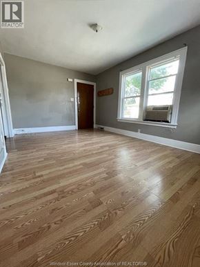 Windsor apartment for rent - A room with wooden flooring and a window.