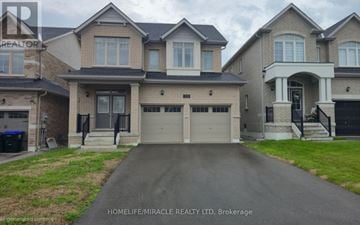 Innisfil apartment for rent - A row of houses with the text HOMELIFE/MIRACLE REALTY LTD, Brokerage.