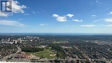 Mississauga (City Centre) condo for rent - A real estate company logo is superimposed on a cityscape.