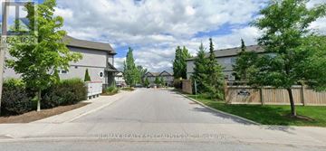 Niagara Falls (Ascot) house for rent - A street view of a residential area with houses on both sides.