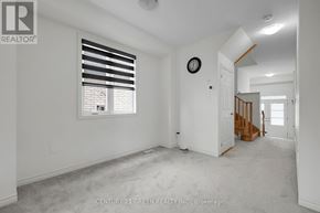 Centre Wellington (Fergus) apartment for rent - A white room with a window and a clock on the wall.