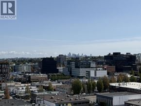 Vancouver apartment for rent - A bedroom with a large bed and a ceiling fan.