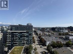 Vancouver apartment for rent - A bedroom with a large bed and a flat screen TV mounted on the wall.