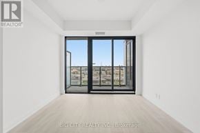 Toronto (Thorncliffe Park) condo for rent - A room with a large window and a sliding door.