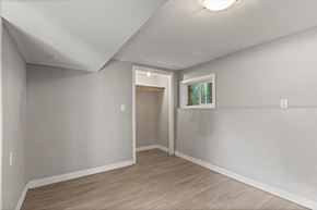 Chilliwack apartment for rent - A room with a door and a window.