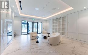 Toronto (Humber Heights) condo for rent - A spacious waiting area with white furniture and marble flooring.
