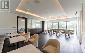Toronto (Humber Heights) condo for rent - A spacious waiting area with beige chairs and a white counter.