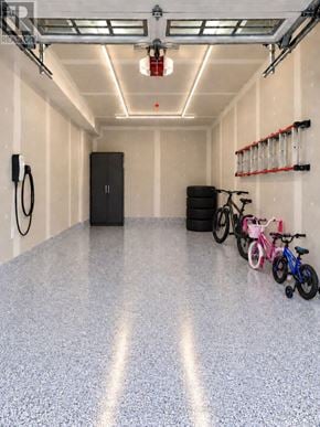 Welland (Lincoln/Crowland) townhouse for rent - A garage with a grey floor and a black door.