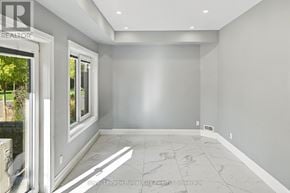 Kitchener condo for rent - A room with a marble floor and white walls.