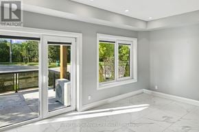 Kitchener condo for rent - A room with a sliding glass door and a window.