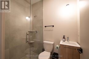 Toronto (Kensington-Chinatown) apartment for rent - A kitchen with a sink, stove, and refrigerator.