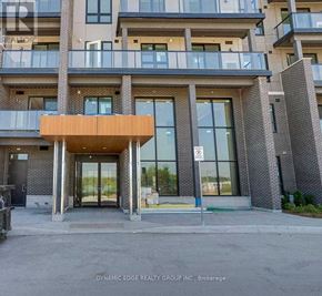 Markham (Greensborough) condo for rent - A building entrance with a glass door and a no parking sign.