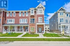 Wasaga Beach townhouse for rent - A row of townhouses with a clear blue sky above them.