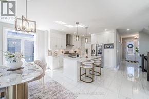 Woodstock (Woodstock - North) apartment for rent - A modern kitchen with white cabinets and a marble island.