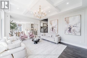Woodstock (Woodstock - North) apartment for rent - A spacious living room with white furniture and a chandelier.