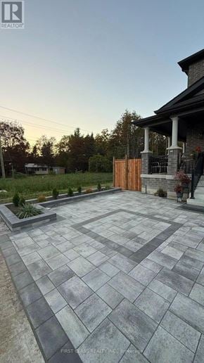 Whitby (Rolling Acres) apartment for rent - A stone patio leads to a house with a wooden gate.