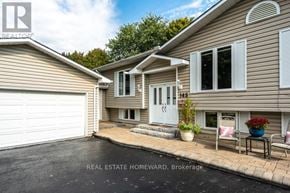 Newmarket (Gorham-College Manor) apartment for rent - A real estate homeward brokerage sign is displayed on a house.