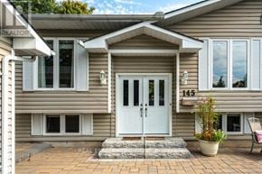 Newmarket (Gorham-College Manor) apartment for rent - A house with a white door and windows is for sale.