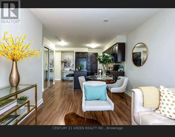 Mississauga (City Centre) condo for rent - A living room with a white couch and a glass coffee table.