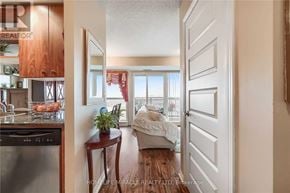 Brampton (Queen Street Corridor) condo for rent - A man is entering a bedroom through a doorway.