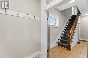 Thorold (Thorold Downtown) apartment for rent - A staircase with a wooden handrail and a window above it.