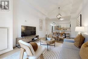 Vaughan (Lakeview Estates) condo for rent - A modern living room with a grey sofa and a wooden coffee table.