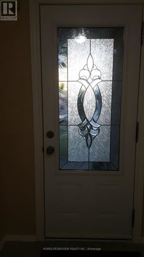 Richmond Hill (Observatory) townhouse for rent - A glass door with a stained glass design in the middle.