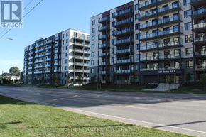 Guelph (Willow West/Sugarbush/West Acres) condo for rent - A building entrance with a glass door and steps leading up to it.