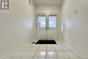 Mississauga (East Credit) apartment for rent - A room with wooden floors and a staircase with a railing.