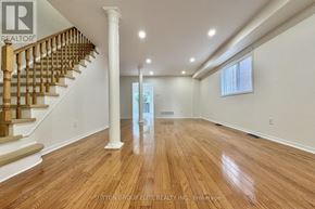 Mississauga (East Credit) apartment for rent - A room with wooden flooring and white walls.