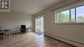 Kitchener multi-family for rent - A room with a table and chairs is shown in the image.