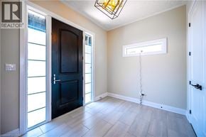 Kitchener apartment for rent - A room with a black door and a window with a white frame.