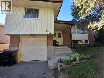 Waterloo apartment for rent - A house with a white garage door and the number 364 on the wall.