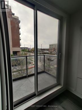 Markham (Unionville) condo for rent - A view from a window looking out at a cityscape.
