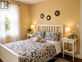 Brock (Beaverton) apartment for rent - A bedroom with a bed, two lamps, and a nightstand.