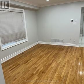 Brampton (Fletcher's Meadow) apartment for rent - A room with wooden flooring and a window with blinds.