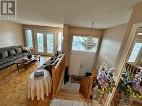 Vaughan (Maple) apartment for rent - A living room with a grey couch and a wooden table.