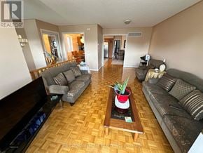 Vaughan (Maple) apartment for rent - A living room with a wooden floor and a coffee table in the middle.