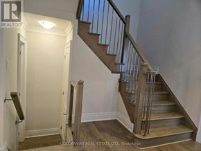 Richmond Hill (Oak Ridges Lake Wilcox) apartment for rent - A staircase with a metal railing and wooden steps.