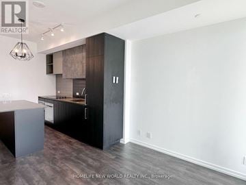 Vaughan (Vaughan Corporate Centre) condo for rent - A modern kitchen with dark wood cabinets and a white wall.