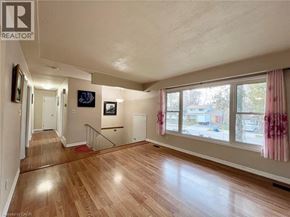Waterloo apartment for rent - A living room with wooden floors and a television on the wall.