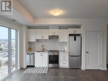 Newmarket (Huron Heights-Leslie Valley) condo for rent - A modern kitchen with white cabinets and stainless steel appliances.