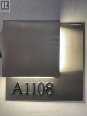 Newmarket (Huron Heights-Leslie Valley) condo for rent - A sign with the number A1108 is mounted on a wall.