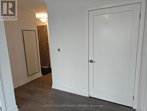 Newmarket (Huron Heights-Leslie Valley) condo for rent - A white door is in a room with a brown door in the background.