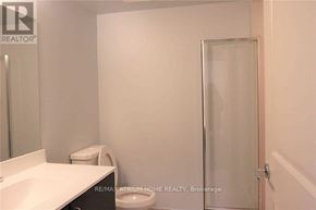 Markham (Unionville) condo for rent - A white bathroom with a toilet, sink, and shower door.