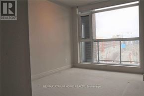 Markham (Unionville) condo for rent - A room with a window showing a view of a street.