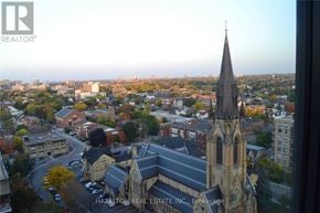 Toronto (Waterfront Communities) condo for rent - A church with a tall steeple is seen from a high vantage point.